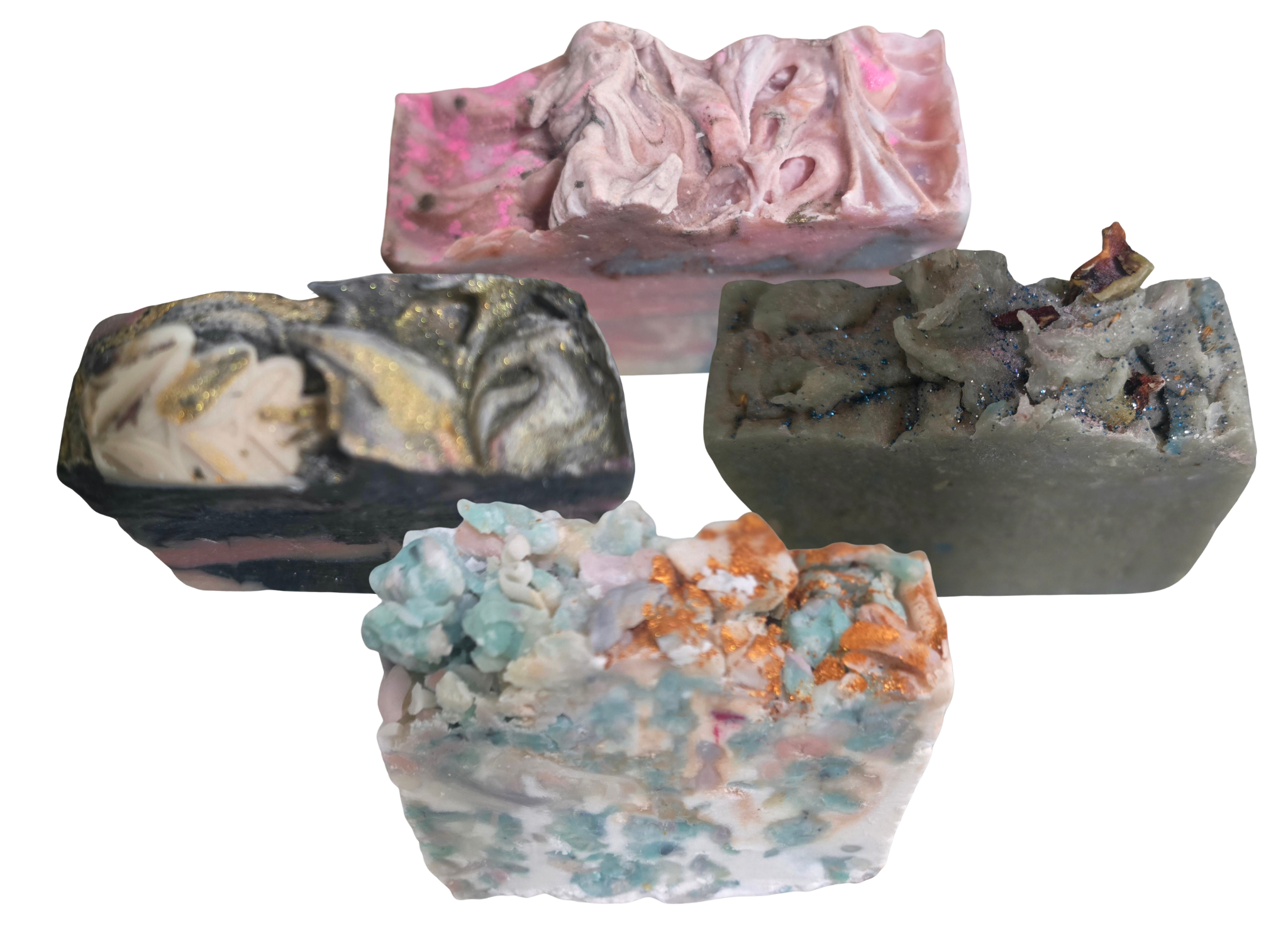 Four different textured organic handmade soaps on a white background