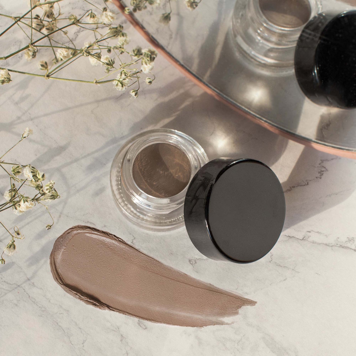 Achieve perfect brows every time with Auburn Brow Pomade from Cruisin Organics. This versatile, multitasking product precisely shapes, fills, and sculpts brows, even for oily skin.