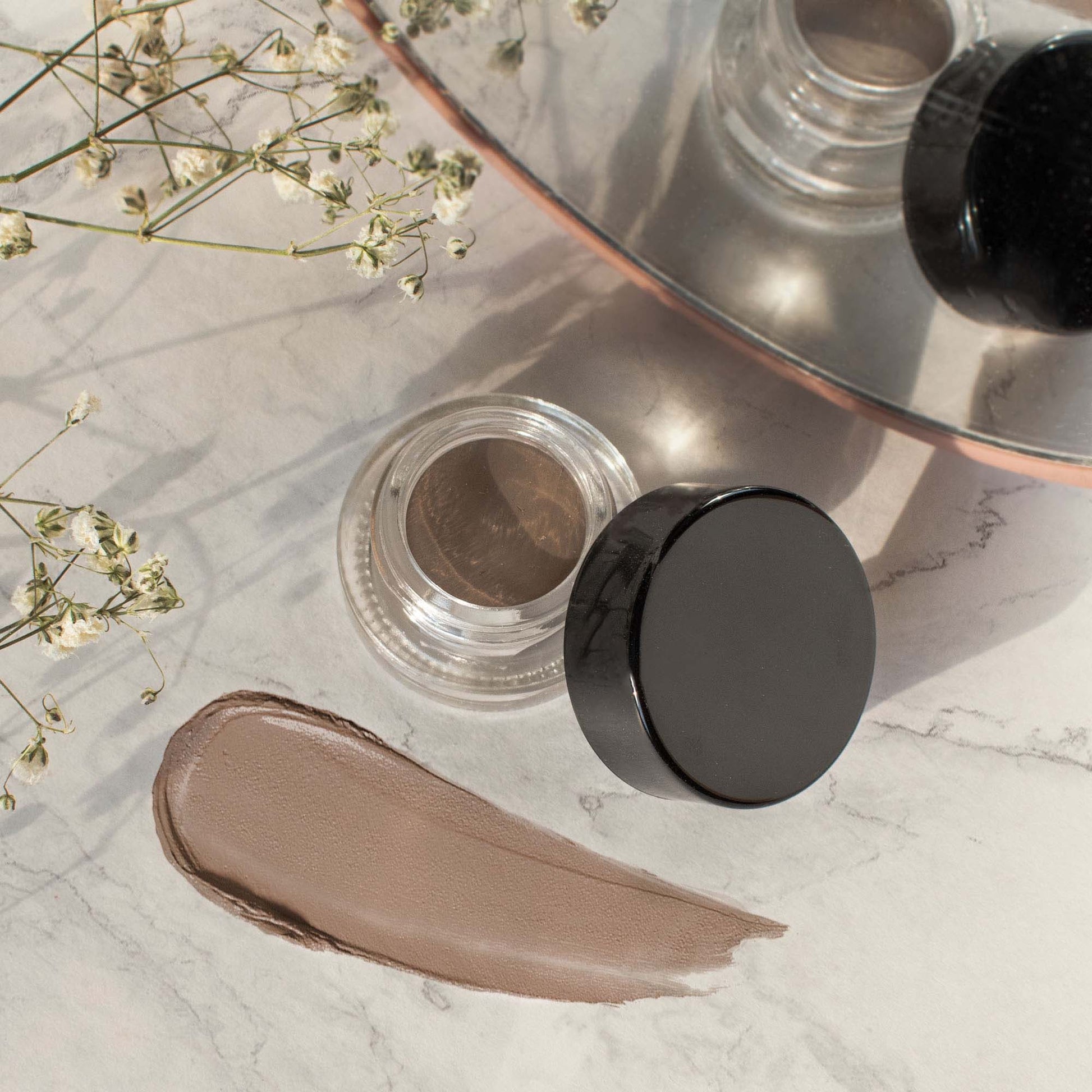 Improve your brow routine with Cruisin Organics' Choco-Latte Brow Pomade. This pomade is both vegan and cruelty-free, providing fullness and definition for both thin and thick brows. Free from parabens and fragrance, it also tames and shapes brows for a polished look.