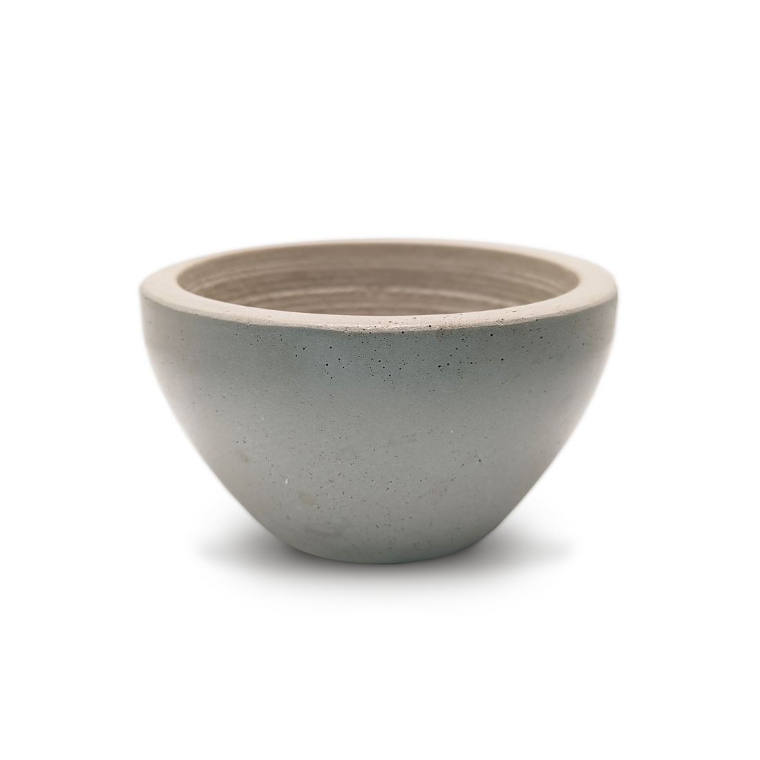 Handcrafted minimal grey concrete shaving bowl with a textured, grooved interior for whipping shaving soap lather.