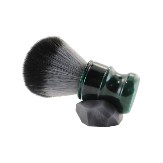 Enhance your shaving routine with our premium synthetic bristle Shaving Brush in a sleek Dark Emerald color. Enjoy a comfortable shave with its rich lathering abilities. The unique stand, handcrafted by skilled artisans, adds a stylish touch to your grooming setup. Upgrade to a luxurious shaving experience today.