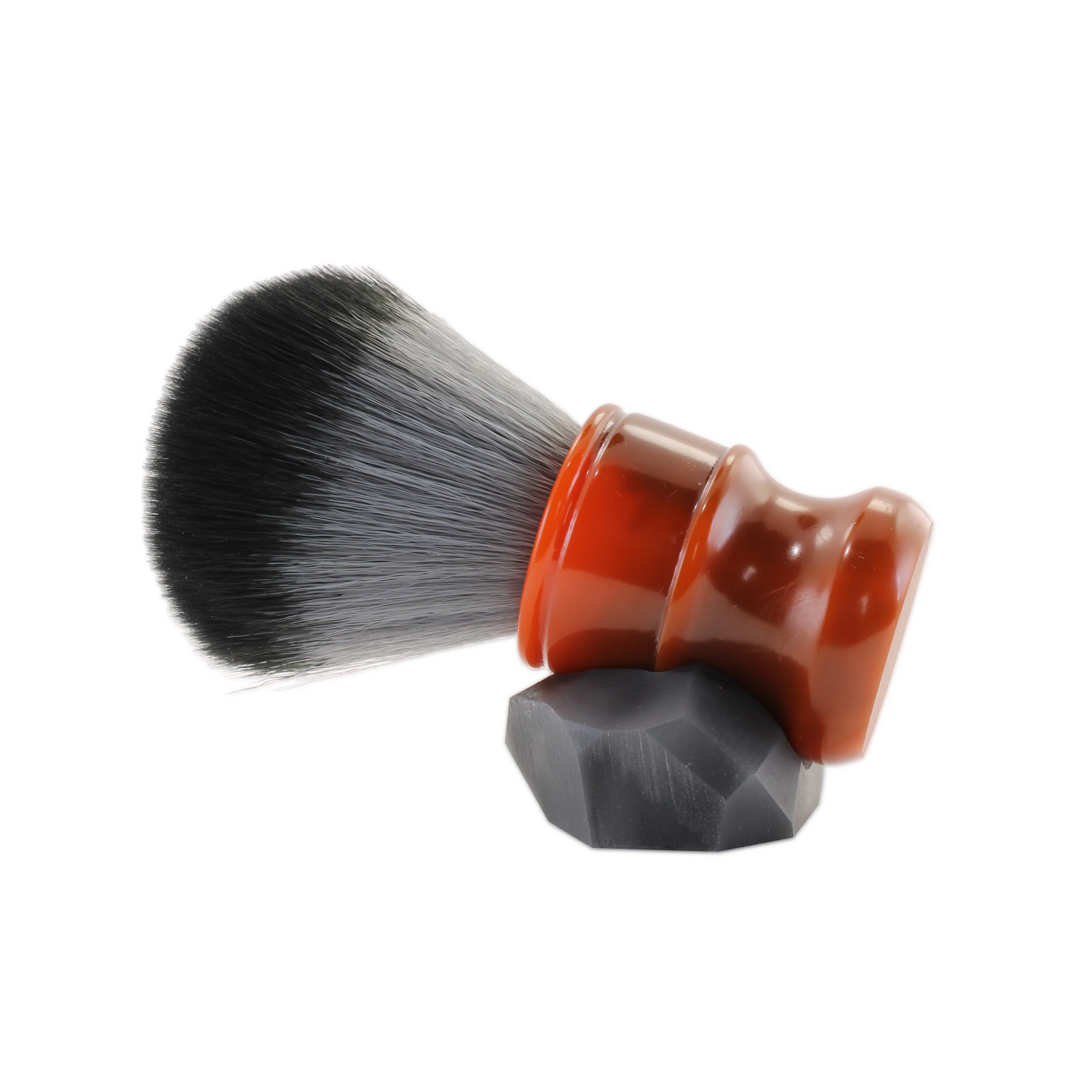 Elevate your shaving experience with our Burnt Orange Artisan Geometric Shaving Brush. Crafted with premium synthetic bristles, each brush creates the perfect foam for a smooth shave. The stylish stand, designed by our skilled artisan, adds a minimalistic touch to your grooming routine. Try it now for a truly satisfying shave.