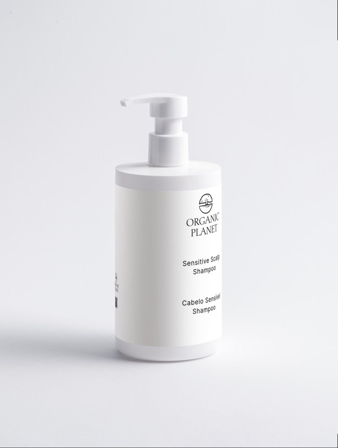 White shampoo bottle with pump labeled &