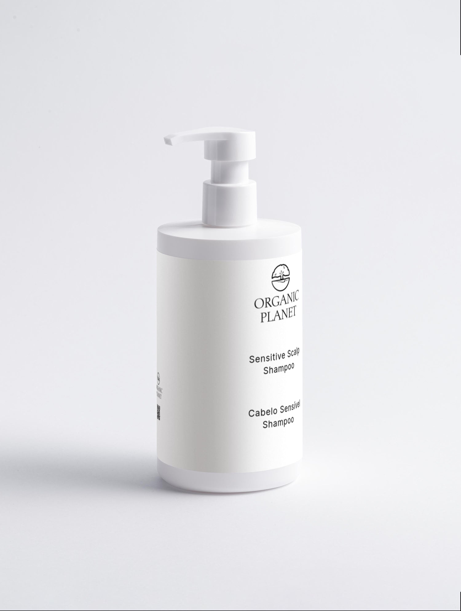 White shampoo bottle with pump labeled &