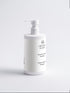 White shampoo bottle with pump labeled &