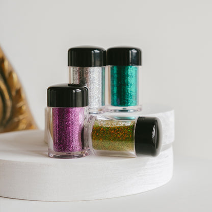 Unleash your inner sparkle with our Amethyst Glitter Dust—the ultimate multi-use shimmer for beauty enthusiasts who refuse to blend in. This ultra-refined glitter clings effortlessly to eyes, skin, nails, and beyond, creating mesmerizing iridescent effects that capture light beautifully.