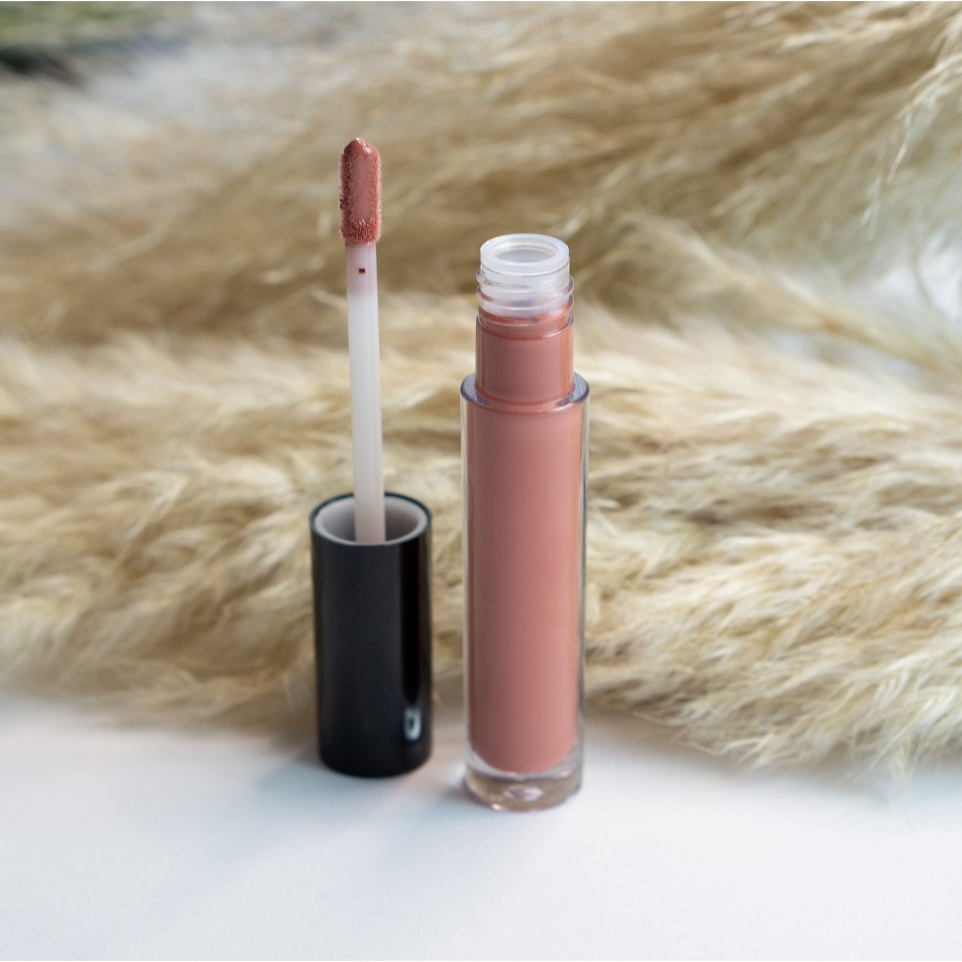 Cruisin Organics Lip Gloss in Chestnut. Use this sheer-tinted lip gloss to achieve the desired lasting shine. its accurate application and ease of use. Select from our vegan and paraben-free shimmer or natural finish options for a cruelty-free and ethical beauty crafted with love.