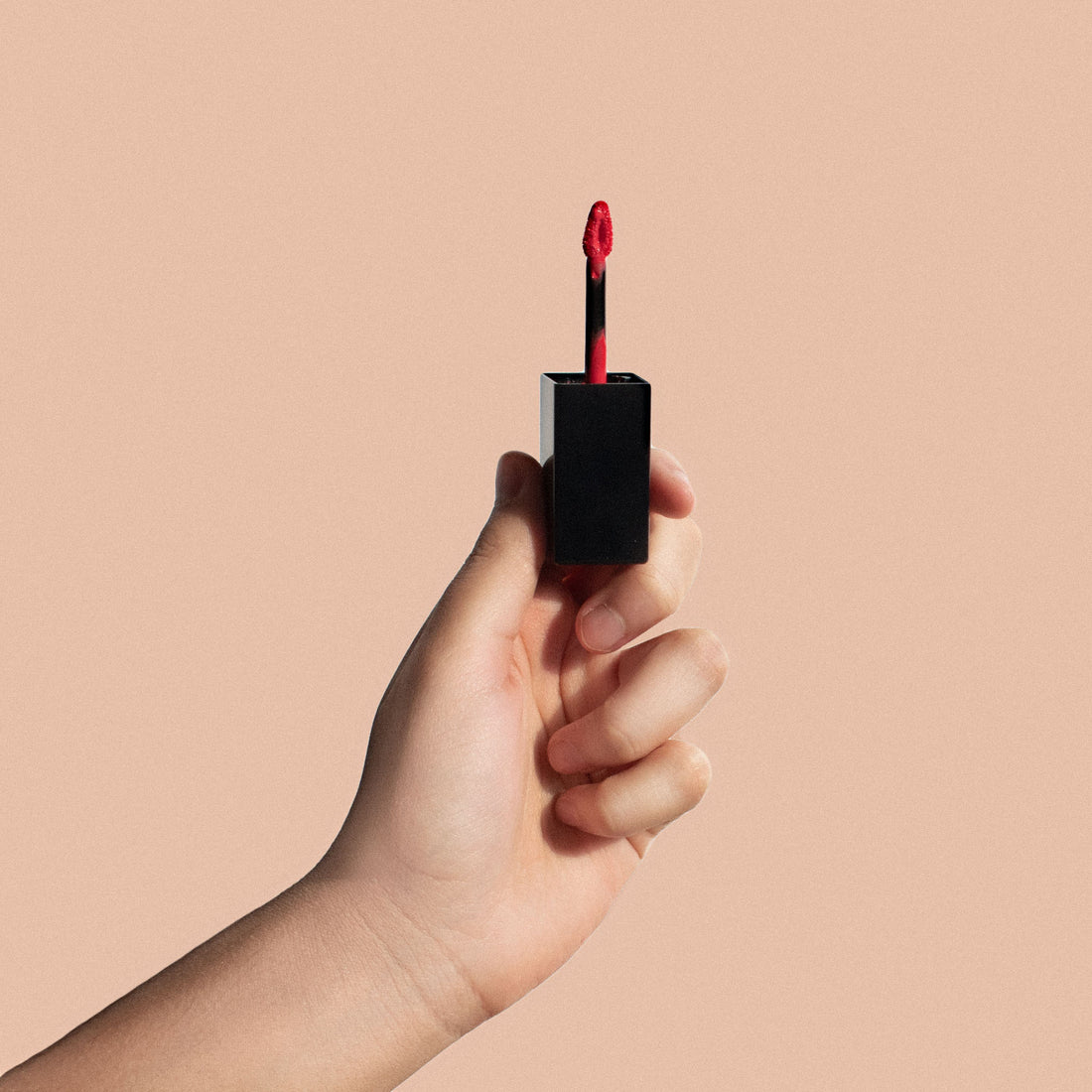 A premium lip shimmer tube displaying the Cruisin Organics Cocoa Kiss Matte Lip Shimmer label, showcasing its rich brown hue against a clean background.