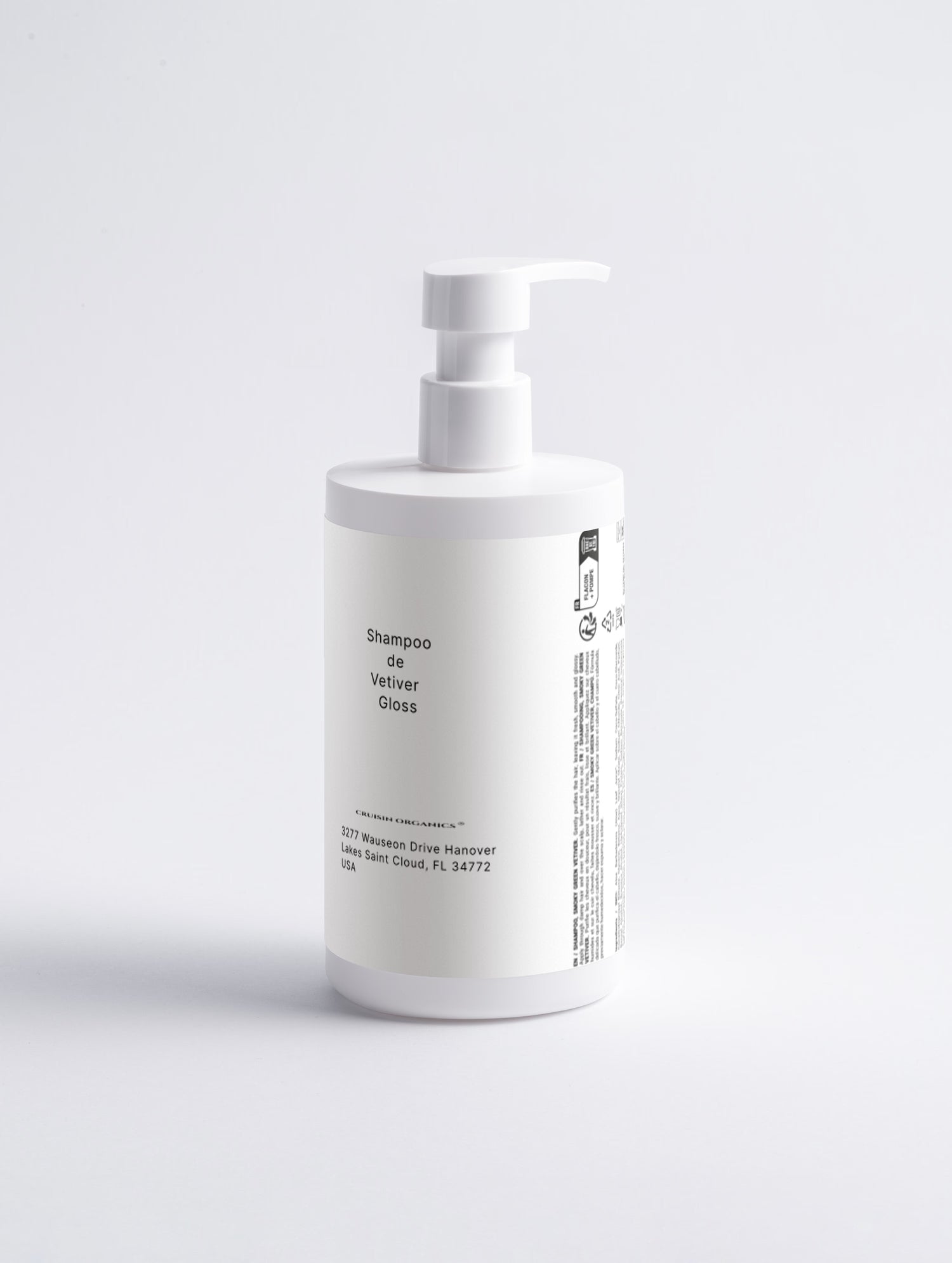White bottle with pump dispenser on a light gray background