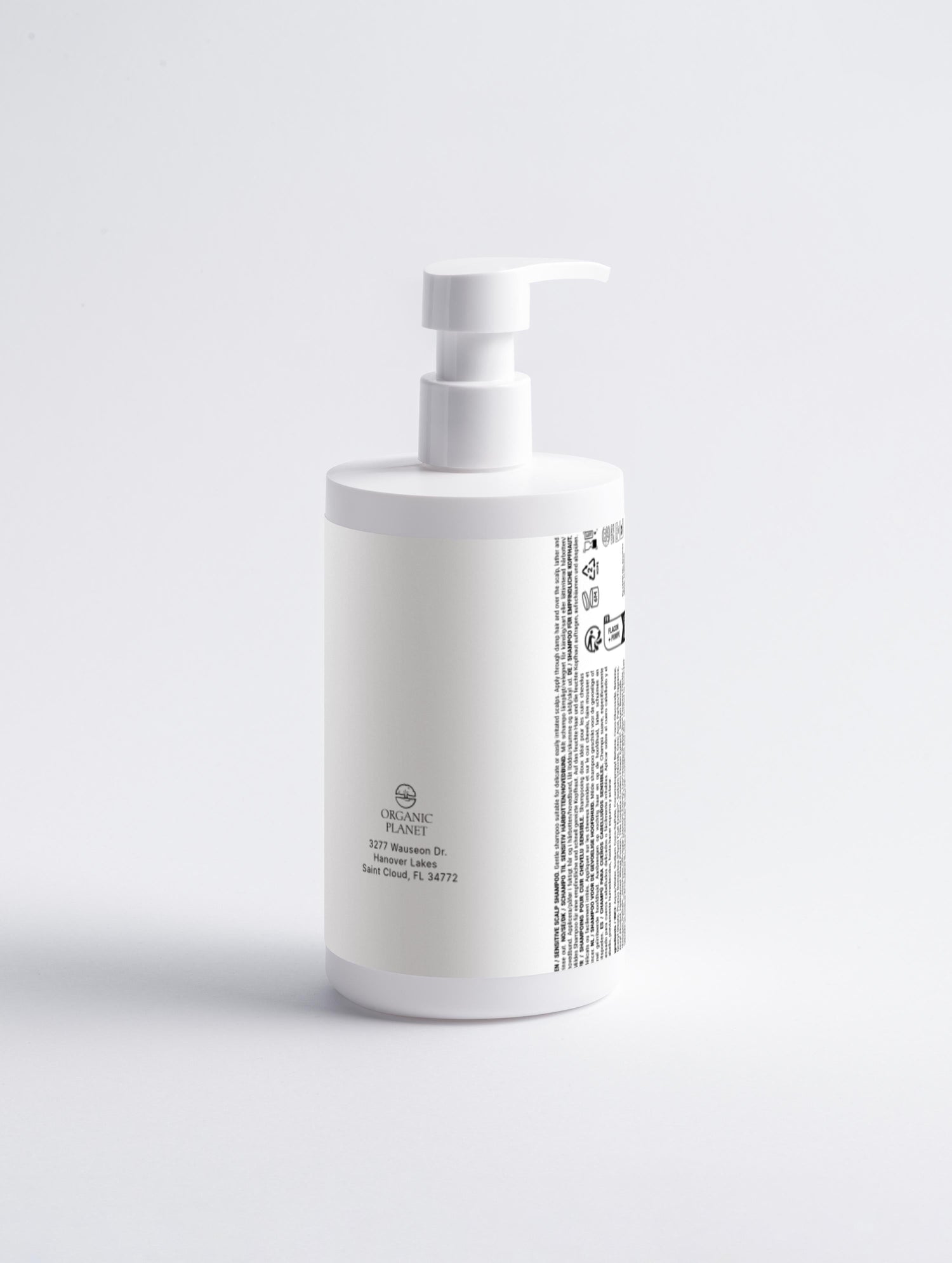 White bottle with pump on a light gray background