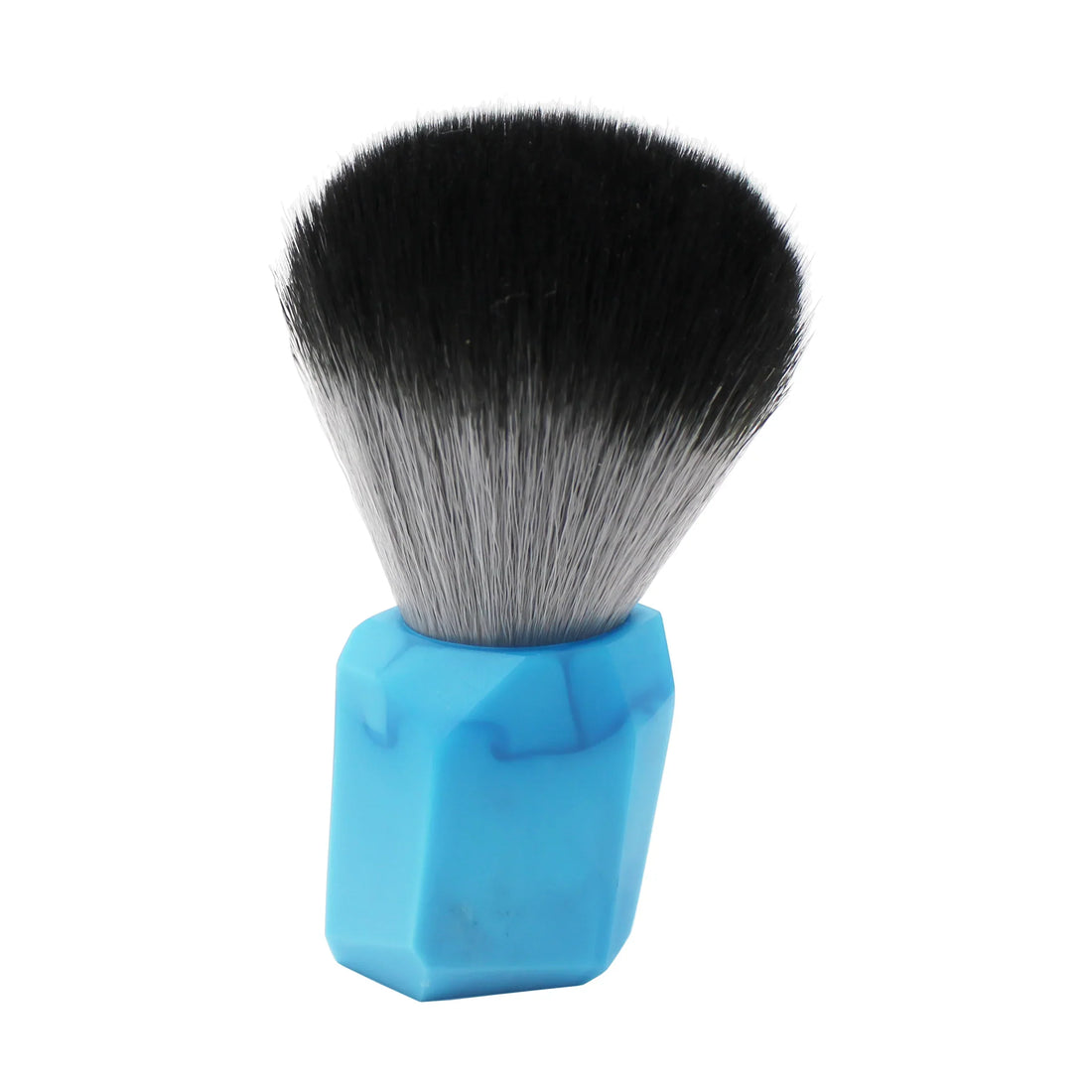 Crafted for Cruisin Organics, the Geo Blue Shaving Brush boasts a unique pattern that sets it apart. The cruelty-free bristles offer a luxurious lather, while the ergonomic design allows for a comfortable grip. Elevate your shaving experience with this distinctive brush.