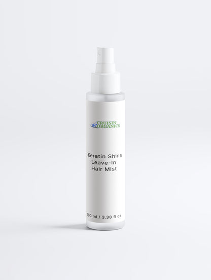 Cruisin Organics Keratin Gloss Leave-In Hair Mist in a clean, transparent spray bottle showing a professional-grade hair care design.
