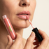 Close-up of lip gloss being applied