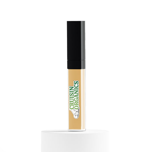 Medium Tan liquid concealer by Cruisin Organics. This SPF-infused concealer provides medium skin tones with flawless coverage while being cruelty-free and vegan. Its lightweight texture blends seamlessly for a natural look and is enriched with vitamins and hyaluronic acid for hydrated, radiant skin. Concealer-953