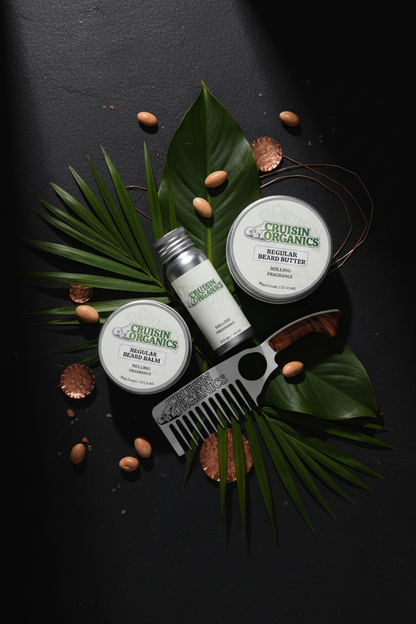 Cruisin Organics Absolute Beard Ritual 4-piece set on black polished stone with tropical botanicals and copper accents