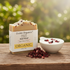 Cruisin Organics bar soap with packaging on a wooden surface with a natural background