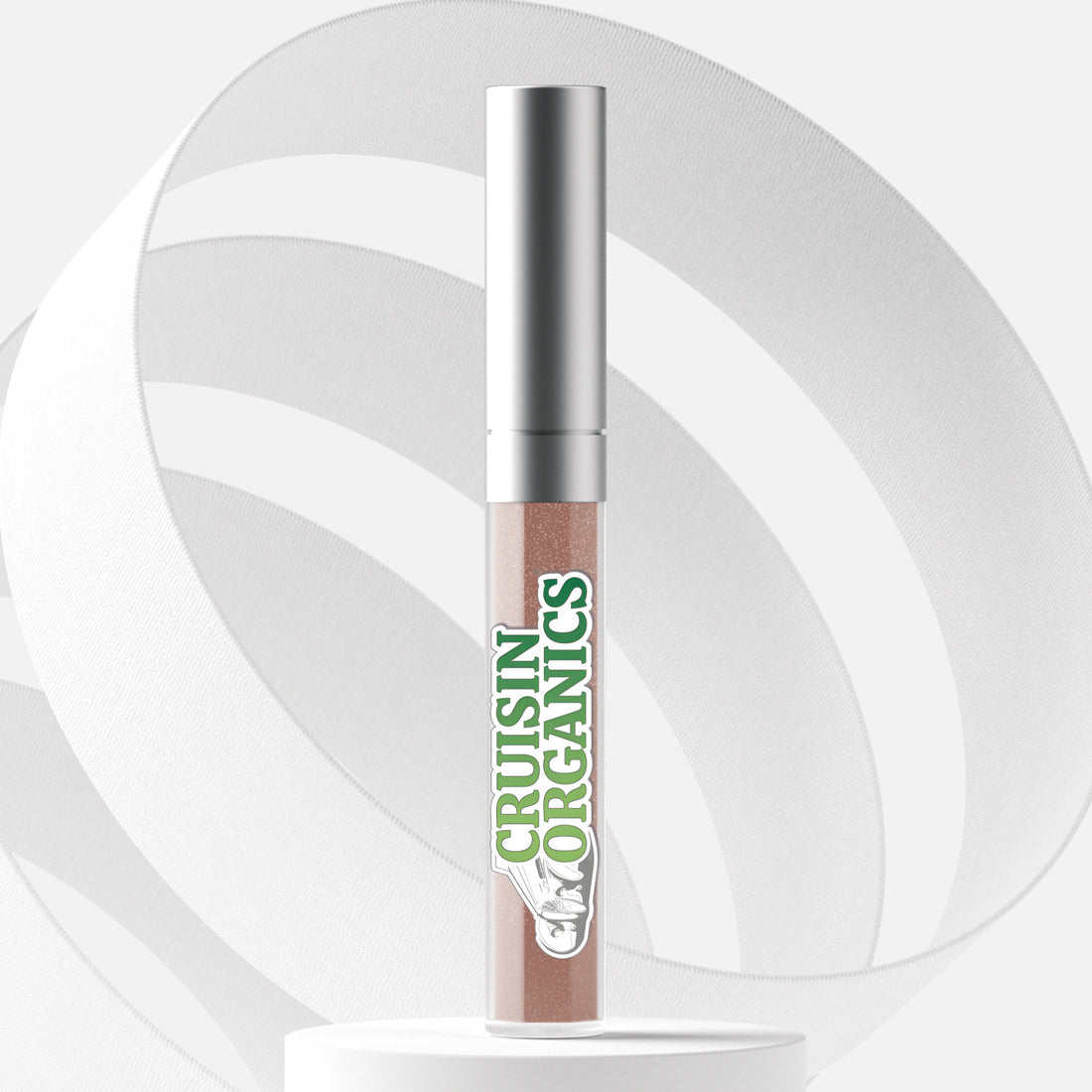 Elevate your lip appearance with Cruisin Organics Kiss Holographic Lip Gloss. Featuring kaleidoscopic pearls, this gloss presents a diverse range of shades suitable for all skin types. It also includes avocado, jojoba, olive, and coconut oil to nourish and hydrate. As a bonus, it is long-lasting and does not contain any animal by-products, gluten, or parabens.