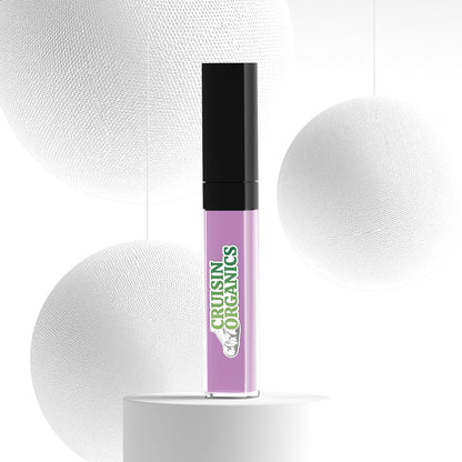 Pedal Glittering Violet Lipstick SPF Lip Stain by Cruisin Organics. Experience the ultimate in natural, vegan beauty with this high-coverage liquid lipstick. The paraben-free, cruelty-free formula offers long-lasting color that won't dry out lips. Infused with vitamin E and nourishing oils like Avocado Oil, Grape Seed Oil, and Jojoba Oil, it provides all-day comfort and hydration. Made in Canada and designed to suit all skin tones, this lipstick is sure to become a beauty favorite. Liquid-Lipstick-Pedal