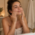 Woman massaging cleansing oil onto her face